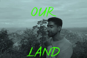 OurLand co-founder Vijo Varghese with a flower in front Western Forest Complex in Thailand
