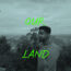 OurLand Co-founder Vijo Varghese With A Flower In Front Western Forest Complex In Thailand; Text On Picture: OUR LAND