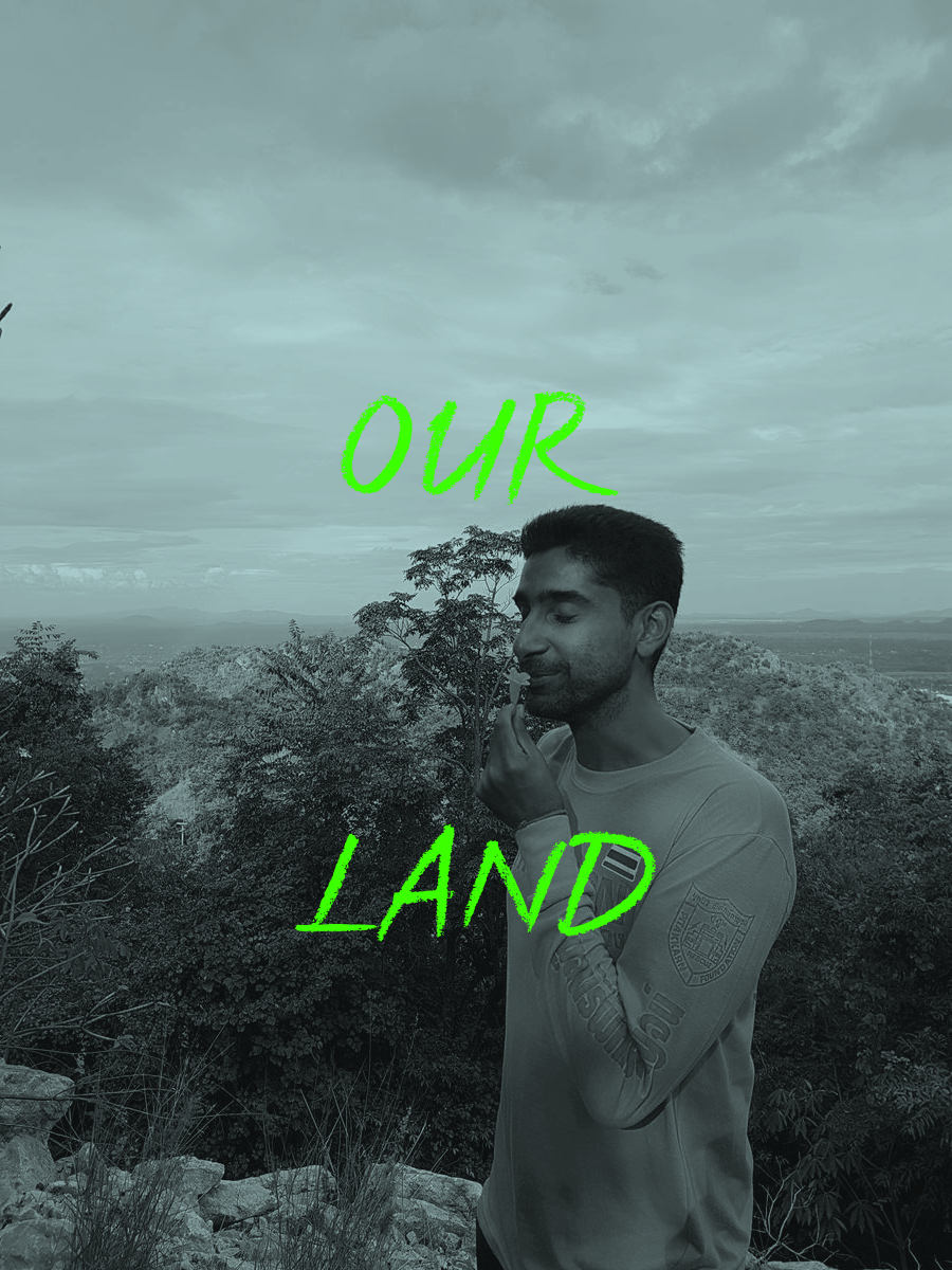 OurLand co-founder Vijo Varghese with a flower in front Western Forest Complex in Thailand; Text on picture: OUR LAND