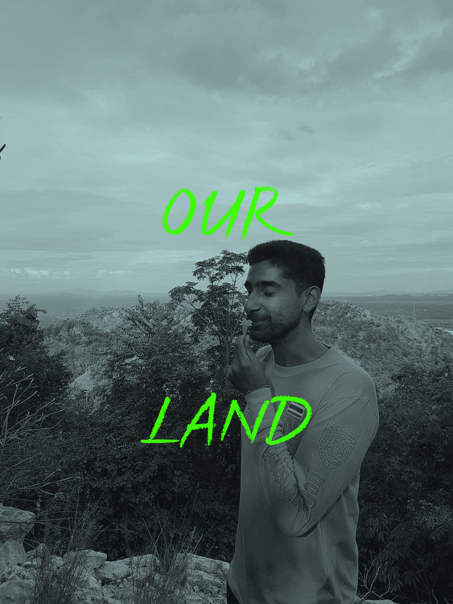 OurLand co-founder Vijo Varghese with a flower in front Western Forest Complex in Thailand