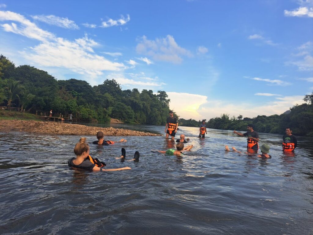 OurLand in Thailand, people floating in the river