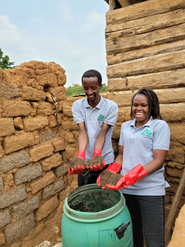two people showing the fertile earth farmers can get from their compost toilet solution Ecosan